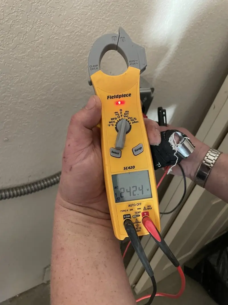 Voltage testing with clamp meter during Outlet Installation in Burke Centre